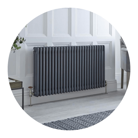 White electric Milano Aruba designer radiator on a grey wall