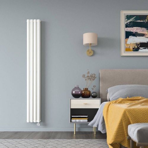 Tall white Milano Aruba electric designer radiator on a grey bedroom wall