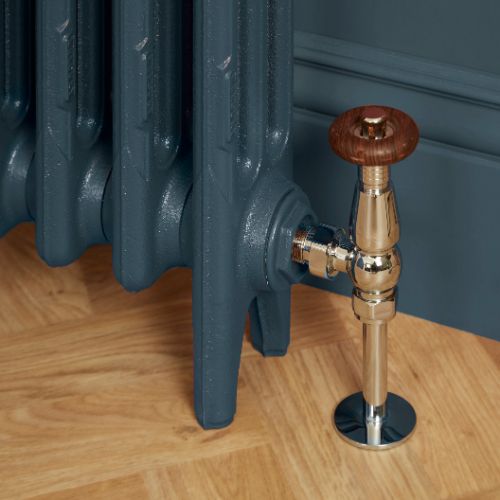 Traditional radiator valve connecting to a cast iron radiator