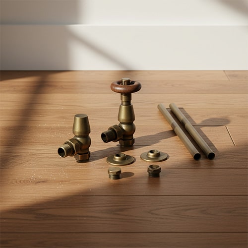 Traditional radiator valves on a wooden floor